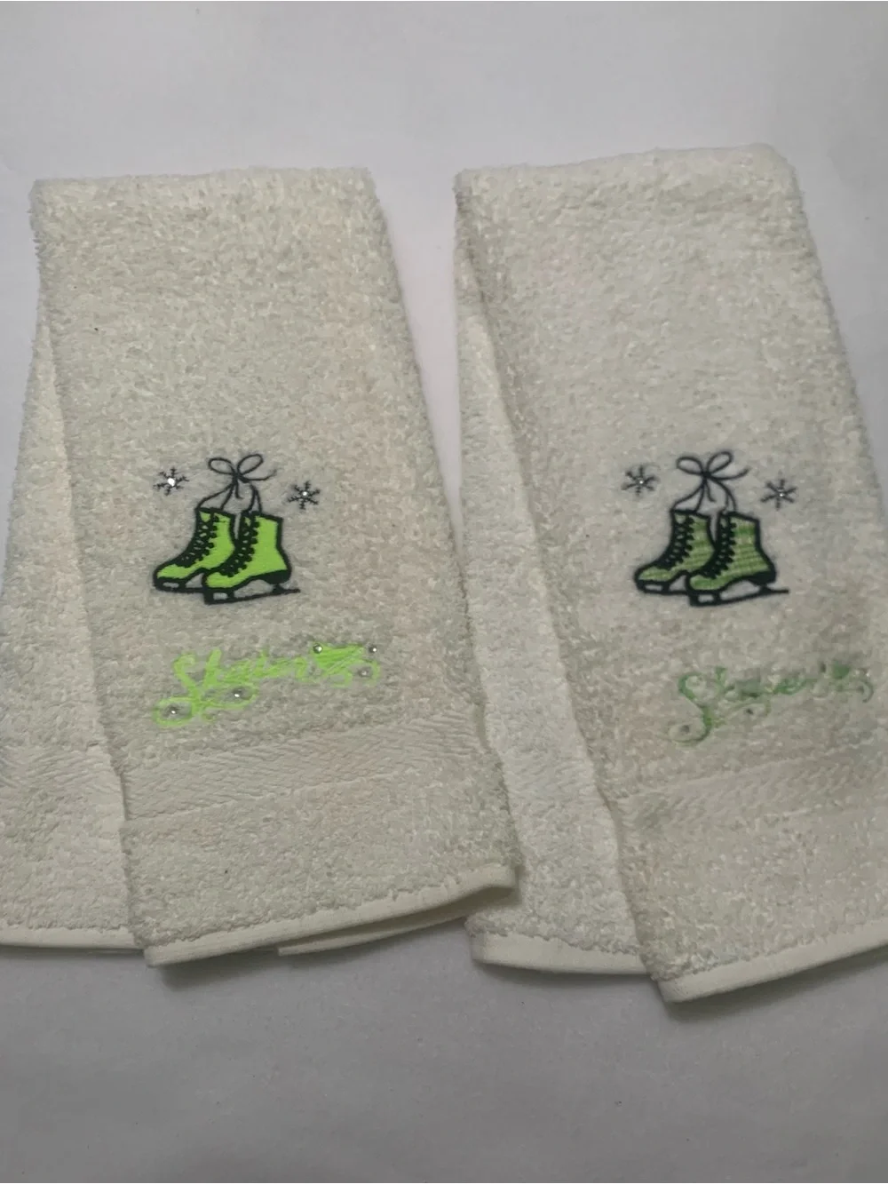 Mystique Boutique White Hand Towels With Embroidered Green Ice Skates Design